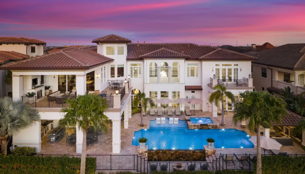 Vacation rental home Legends Palace at Reunion Resort & Golf Club pool view at sunset